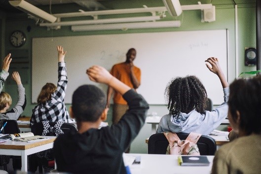 Classroom Chidlren Raising Hands